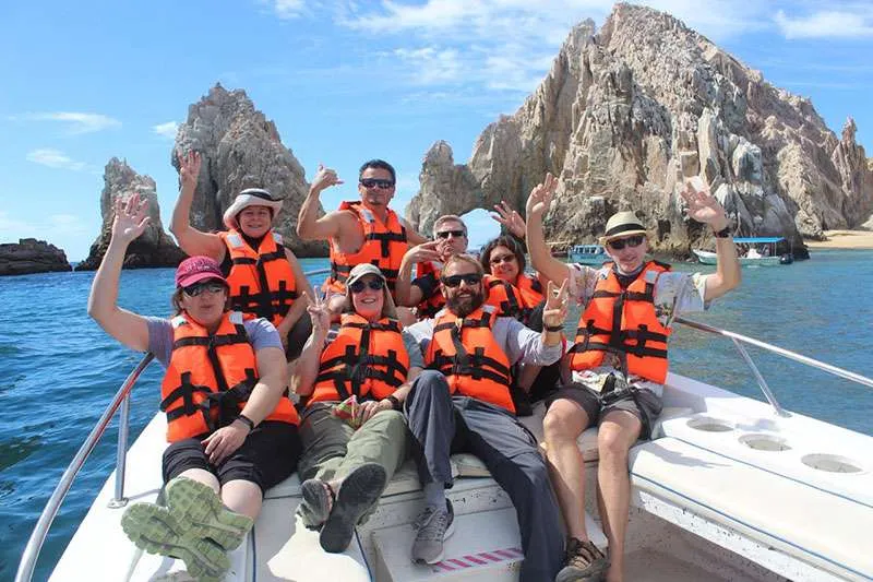 Group shot in front of the Arch of Cabo San Lucas